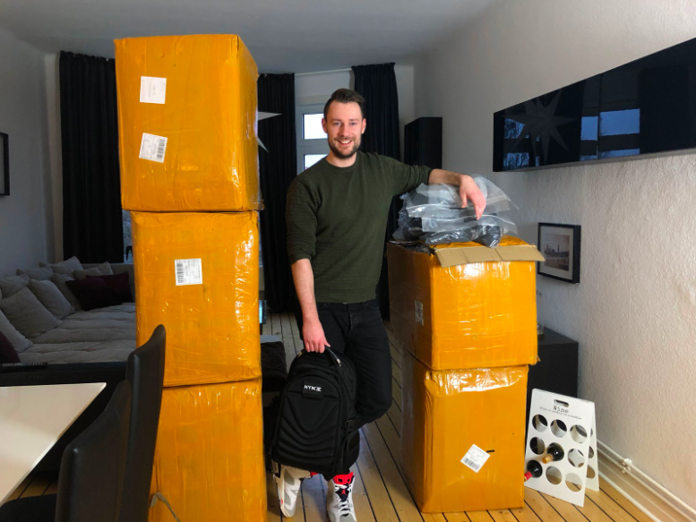 Picture showing Tim Kock and his bagpacks in boxes