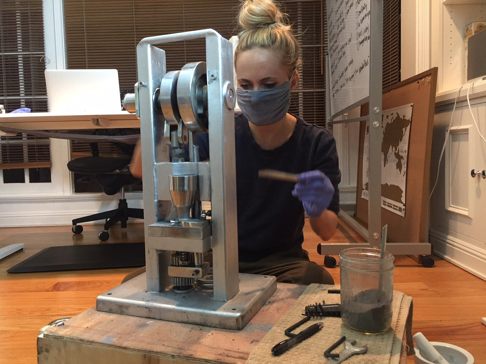 Picture showing a woman working on a machine