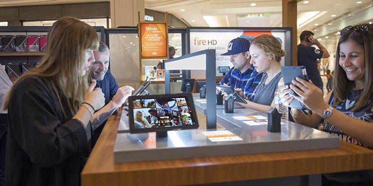 Screenshot showing people at an amazon retail store